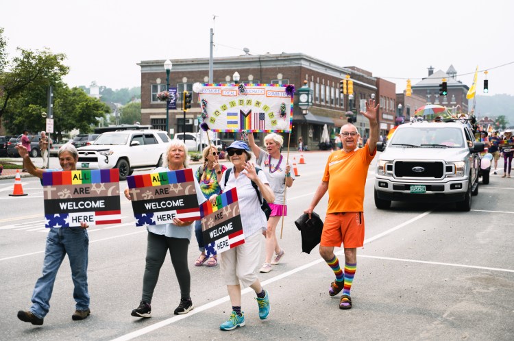 Westmore Democratic Committee with signs: All are welcome here